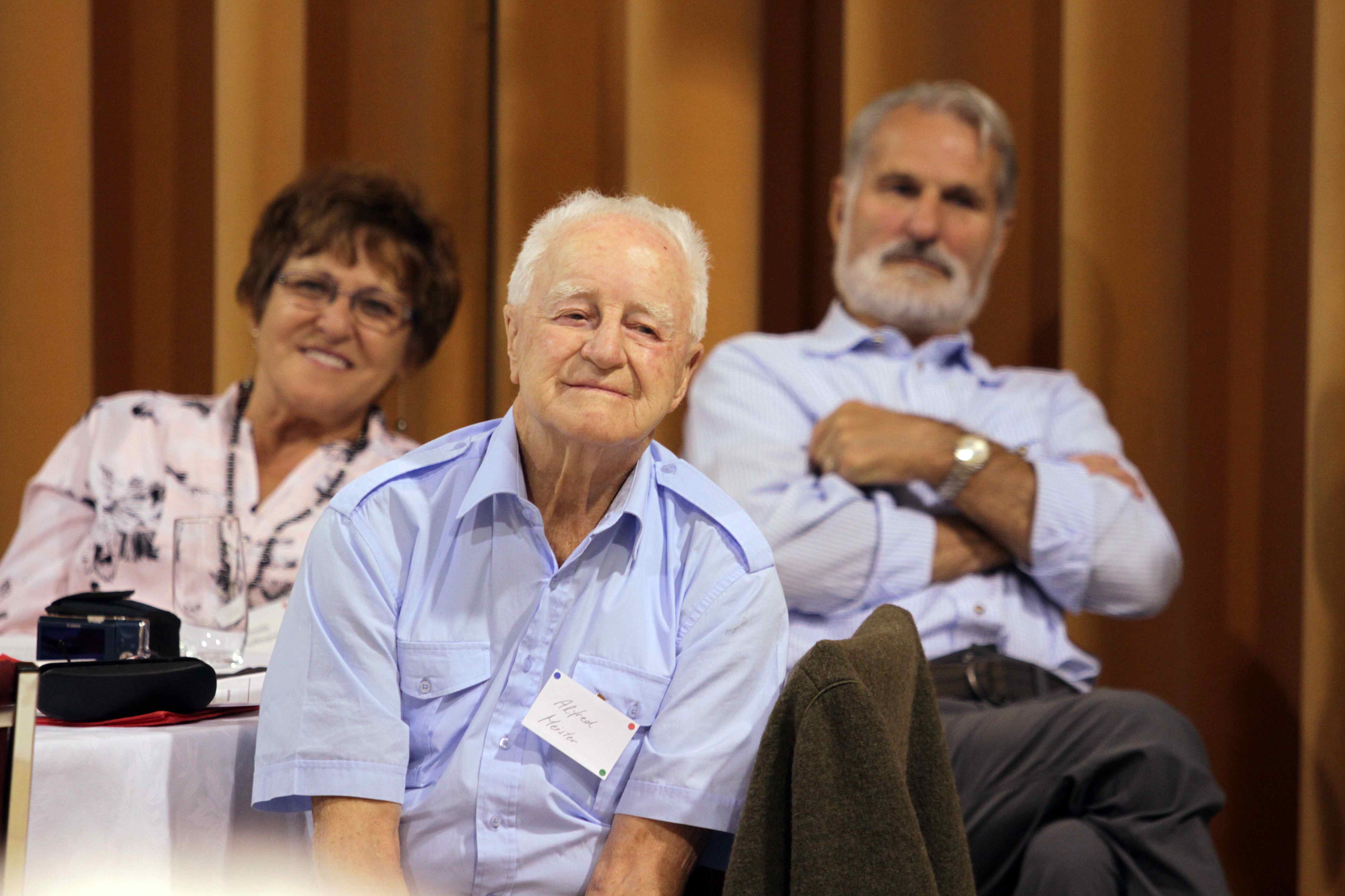 Symposium participants listen intently